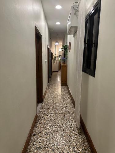 a corridor of a hallway with a tile floor at Rosa apartment in Venice