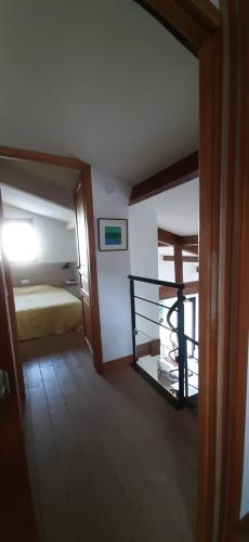 a room with a bedroom with a bed and a window at Villa Troc Pinell in Banyuls-sur-Mer