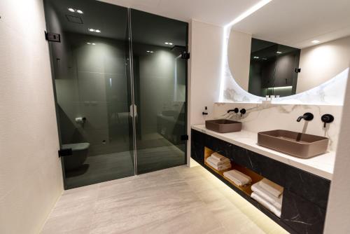 a bathroom with a sink and a shower at Blue Bay Curaçao Golf & Beach Resort in Willemstad