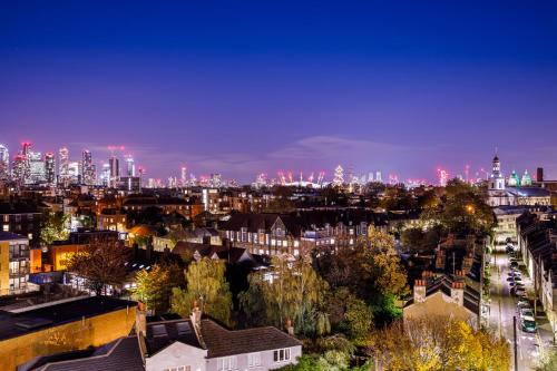 a view of a city at night at Novotel London Greenwich in London