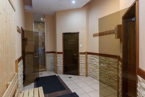a hallway with a door in a room at St George Ski & Holiday - Half Board & All Inclusive in Bansko