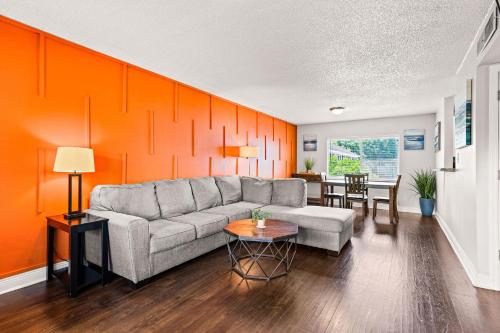 a living room with a couch and a table at Avenida in Tampa