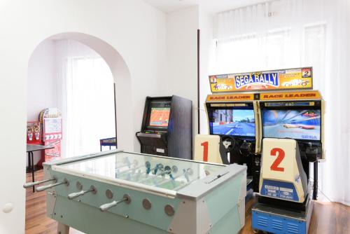 a video game room with a pinball machine at St George Ski & Holiday - Half Board & All Inclusive in Bansko