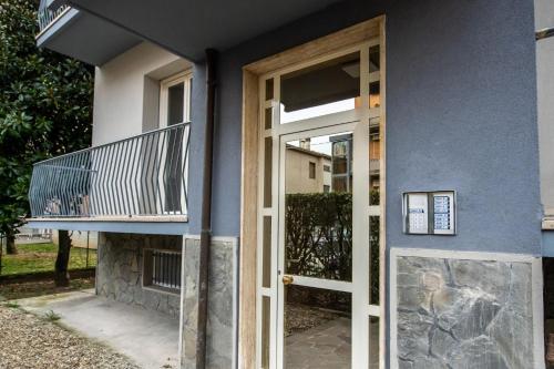 a door to a house with a balcony at GG12 Parma Comfort & Parking Suites in Parma
