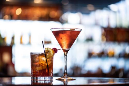 a martini and a drink on a table at Hilton Milwaukee in Milwaukee