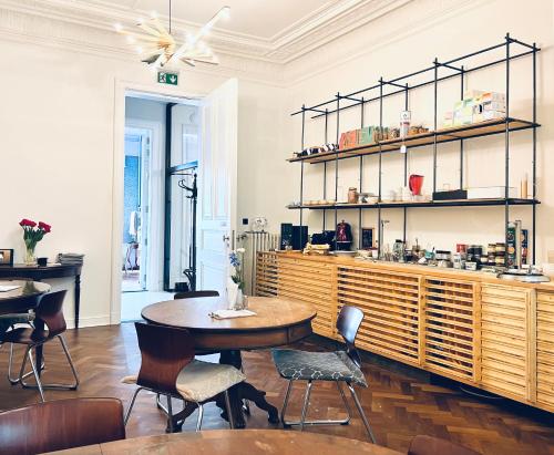 a restaurant with a table and chairs and a counter at 22b&b in Antwerp