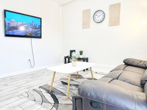 a living room with a couch and a table at Modern Retreat Just Outside The City in San Diego