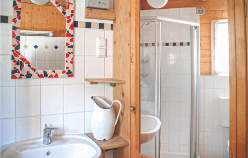 a bathroom with a sink and a toilet and a shower at Amazing Home In Bad St, Leonhard With Kitchen in Bad Sankt Leonhard im Lavanttal