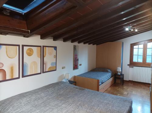 a bedroom with two beds and a window at Villa Camelia Tuscany in Pescia