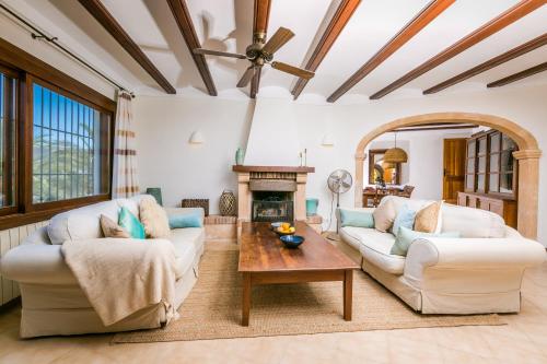 a living room with two couches and a table at Casa Toscana in Jávea