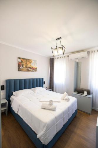 Postel nebo postele na pokoji v ubytování Tier Hotel