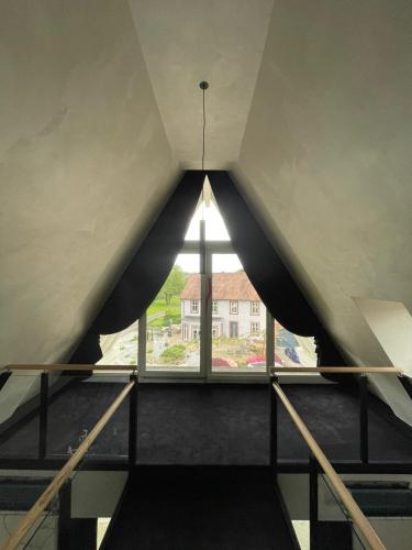 a view from the top of a building with a window at LES GITES DE LA KARLSMUHLE in Haguenau
