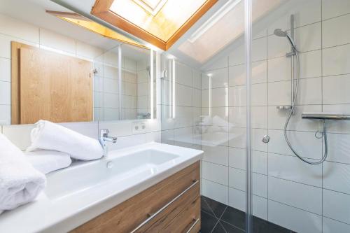 a bathroom with a sink and a shower at Drei Türme Top A5 in Schruns