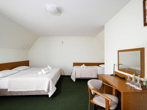 Posteľ alebo postele v izbe v ubytovaní Pensjonat Dziubas - 5 minut na piechotę do stacji narciarskiej Kotelnica i term Bania, parking przy obiekcie