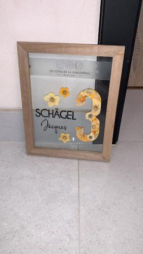 a framed picture of a sign that reads sliced pretzels at LES GITES DE LA KARLSMUHLE in Haguenau