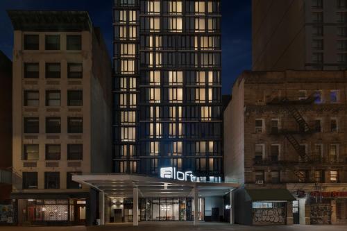 a building with a sign in front of it at Aloft New York Chelsea in New York