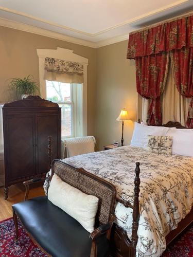 a bedroom with a large bed and a window at Hollinger House in Lancaster