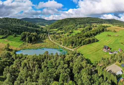 an aerial view of a valley with a lake at Siwejka - Ropki - Beskid Niski in Ropki