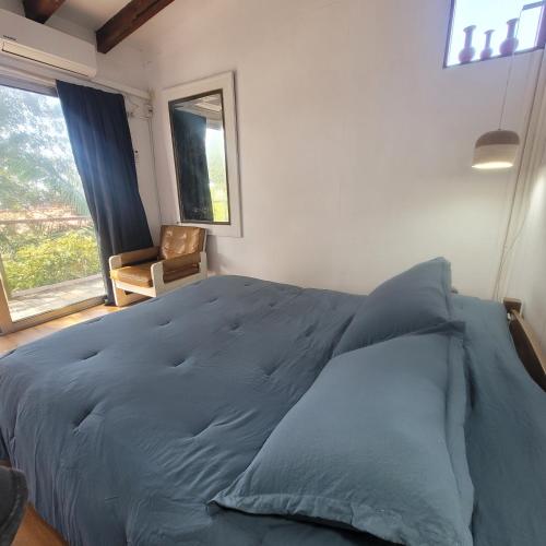Ένα ή περισσότερα κρεβάτια σε δωμάτιο στο Casa Encantada Guest House
