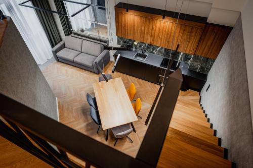an overhead view of a living room with a table and chairs at Bursztynowe Resort&SPA Stegna in Stegna