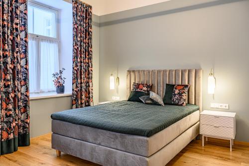 a bedroom with a large bed in a room at Lossi Old Town apartment with sauna in Tartu