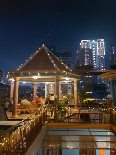 a gazebo on top of a building at night at Saigon Rooftops Hostel in Ho Chi Minh City