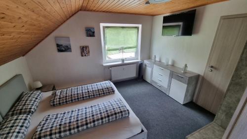 Postel nebo postele na pokoji v ubytování Fewo Spiegelberg