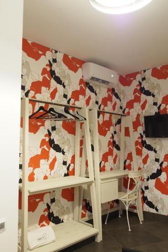 a room with two bunk beds and a wall withadobeadobeadobeadobeadobeadobe at Terrazzani Suite in Comiso