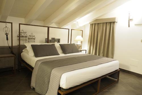 מיטה או מיטות בחדר ב-Terrazzani Suite