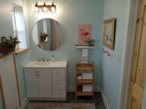 a bathroom with a sink and a mirror at Relax and Enjoy Bayou Grande in Pensacola