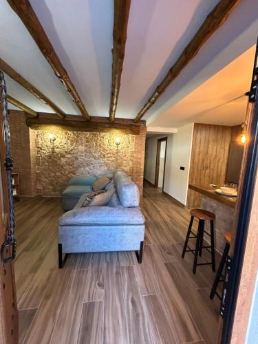 a living room with a couch and a table at Apartamento Peña Cortada in Alhama de Aragón