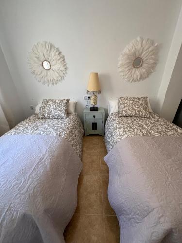 En eller flere senge i et værelse på El Mirador de Velez Blanco
