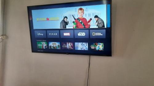 a flat screen tv hanging on a wall at Refugio Renacer in Pisco Elqui