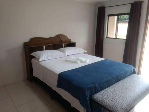 Кровать или кровати в номере Hotel Pousada em frente ao Nações Shopping