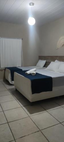 a bedroom with a large bed in a room at Pousada Nordestina in Recife