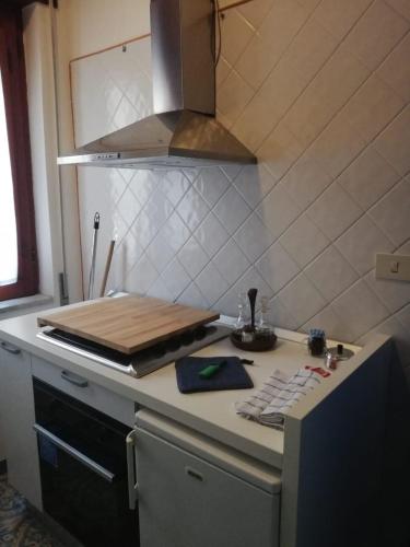 a kitchen with a counter with a cutting board on it at Residence Le Villette in Ravello