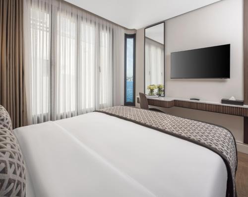 Ένα ή περισσότερα κρεβάτια σε δωμάτιο στο Dream Inn Karaköy Bosphorus
