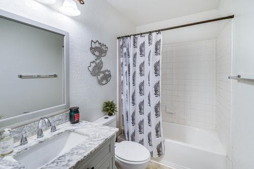 a bathroom with a sink and a toilet and a shower at San Antonio House with Pool about 9 Mi to Lackland AFB! in San Antonio