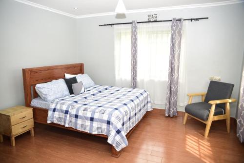 Postel nebo postele na pokoji v ubytování EMALI ARUSHA HOME