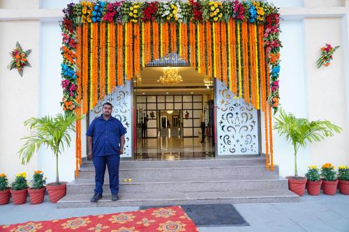 a man standing in front of a building at Hotel KP Palace in Tālcher