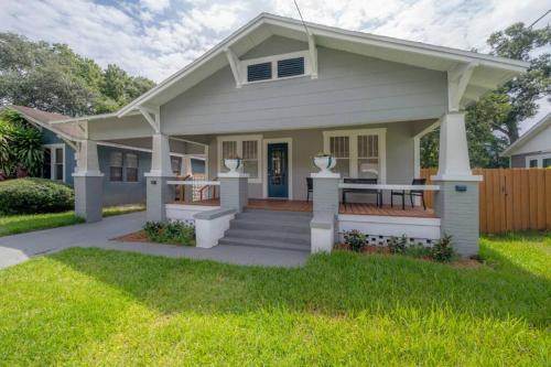 a house with a front porch with a patio at Rustic Bungalow Near Downtown/ Foodie Hotspots in Tampa