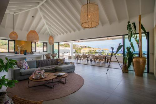 a living room with a couch and a table at Blue Bay Curaçao Golf & Beach Resort in Willemstad
