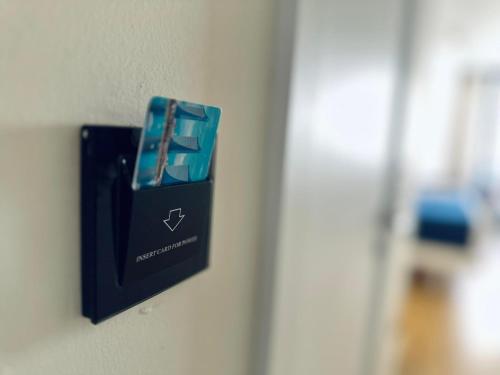 a black electrical outlet on a wall at Luxury PANORAMA sea view apartment & Central Batumi in Batumi