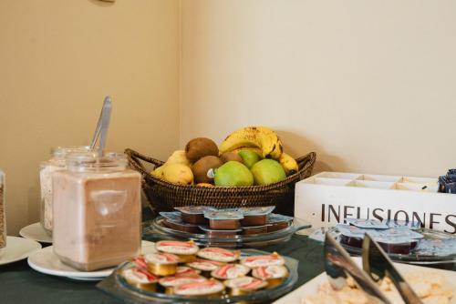 a basket of fruit sitting on top of a table at Punta Trouville Hotel in Montevideo
