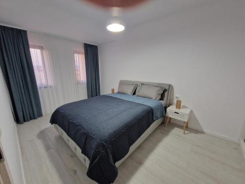 Ένα ή περισσότερα κρεβάτια σε δωμάτιο στο Apartament Eva