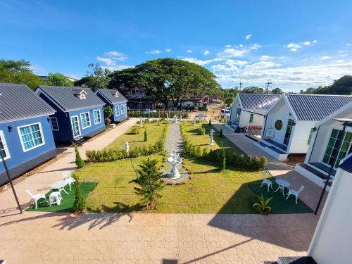 an aerial view of a village with blue houses at Raintrary House Nakhon Phanom เรนทารี่เฮาส์นครพนม in Nakhon Phanom