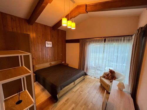 a bedroom with a bed and a window at Villa - VALL DI VALL in Pirin Golf & Country Club in Razlog
