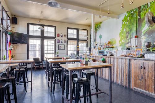 a restaurant with wooden tables and chairs in a room at HI San Francisco Fisherman's Wharf Hostel in San Francisco