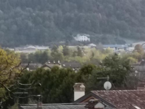 a view of a town with trees and houses at Casa Castegner - Rooms in Seren del Grappa