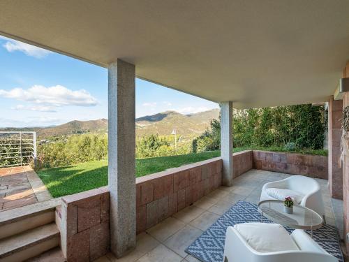 a balcony with a view of the mountains at Villa Serenity in Terra Mala